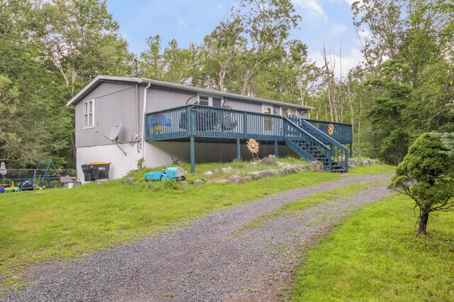 865 Snow Hill Rd, Cresco, PA 18326 - view of front facade with a wooden deck, stairway, and a front yard