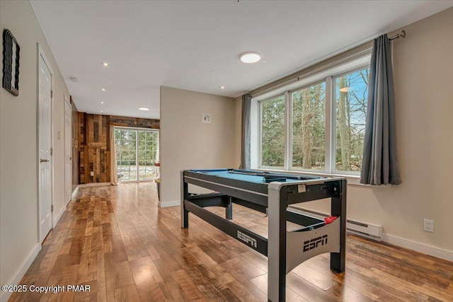 playroom featuring baseboard heating, billiards, hardwood / wood-style floors, plenty of natural light, and recessed lighting