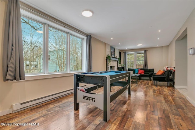 recreation room with a baseboard radiator, hardwood / wood-style floors, billiards table, recessed lighting, and baseboards