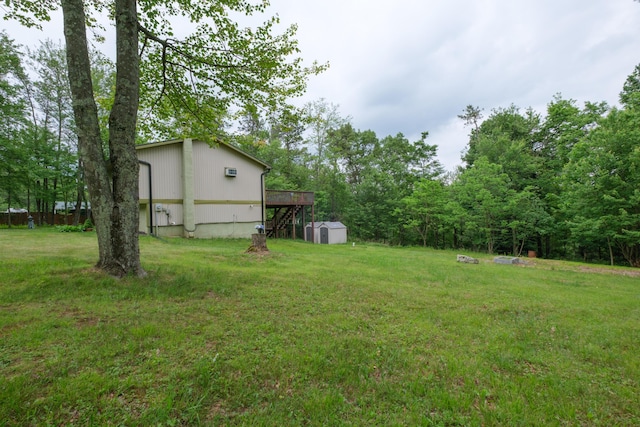 205 W Williams Ct, Stroudsburg, PA 18360 - view of green lawn with a storage shed and a deck