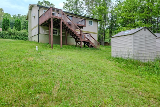 205 W Williams Ct, Stroudsburg, PA 18360 - back of property featuring stairway, a deck, a yard, and a shed