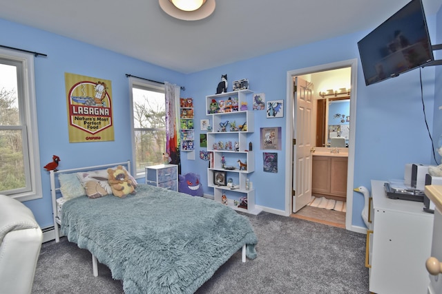 bedroom with ensuite bathroom, carpet, a baseboard heating unit, and baseboards