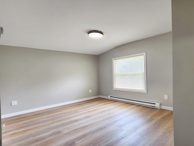 3546 High Hill Rd, Effort, PA 18330 - empty room featuring a baseboard heating unit, wood finished floors, and lofted ceiling