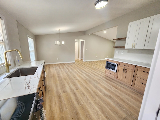 3546 High Hill Rd, Effort, PA 18330 - kitchen featuring open shelves, appliances with stainless steel finishes, light wood-style floors, light stone countertops, and decorative light fixtures