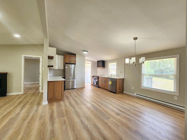 3546 High Hill Rd, Effort, PA 18330 - kitchen featuring appliances with stainless steel finishes, a baseboard radiator, light countertops, a chandelier, and light wood-style flooring