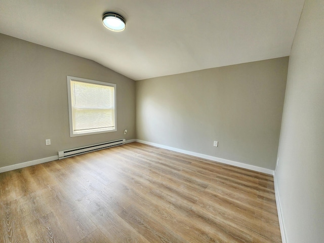 3546 High Hill Rd, Effort, PA 18330 - unfurnished room with a baseboard radiator, vaulted ceiling, and light wood finished floors