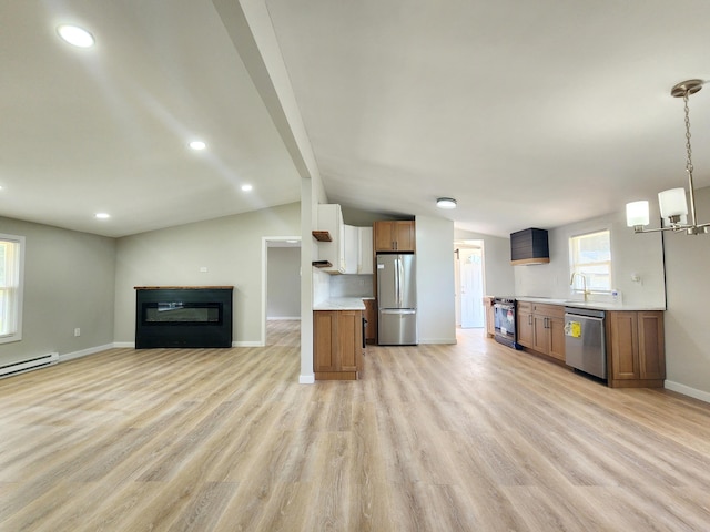 3546 High Hill Rd, Effort, PA 18330 - kitchen featuring stainless steel appliances, open floor plan, lofted ceiling, light countertops, and light wood finished floors