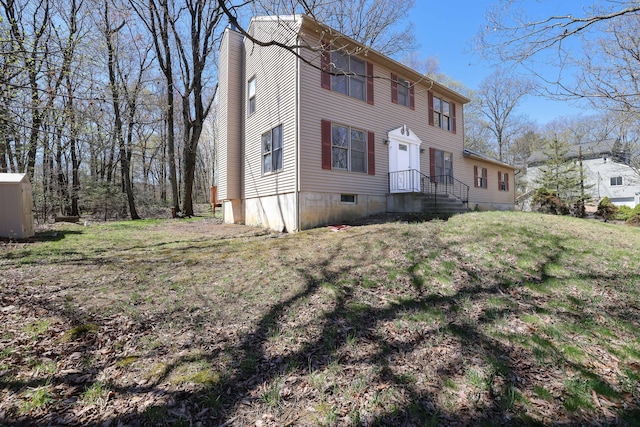 exterior space featuring a lawn and a chimney