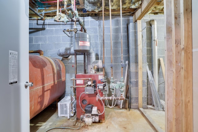 unfinished below grade area featuring a heating unit and heating fuel