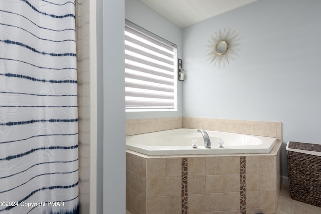 bathroom with a shower with shower curtain and a bath