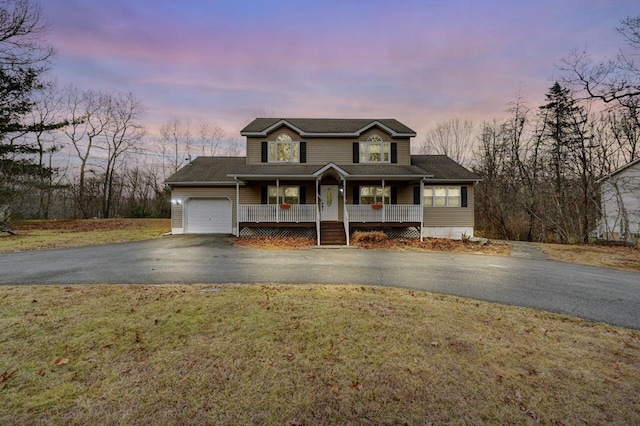1531 Slope Rd, East Stroudsburg, PA 18302 - view of front of property featuring driveway, covered porch, an attached garage, and a lawn