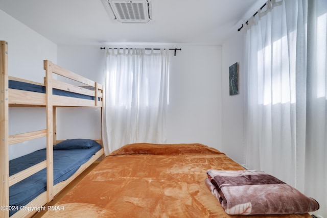 bedroom with visible vents