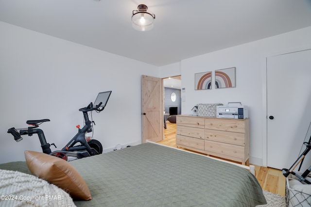 bedroom featuring light wood-style flooring