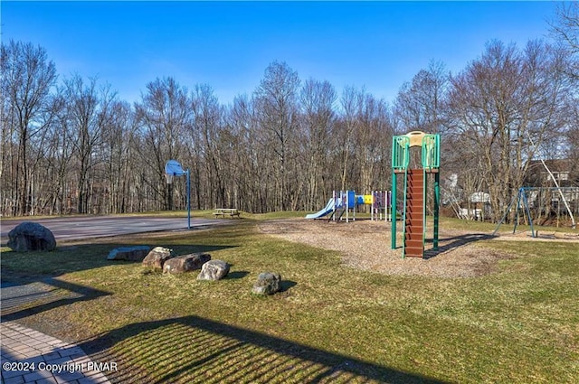 community play area featuring a lawn