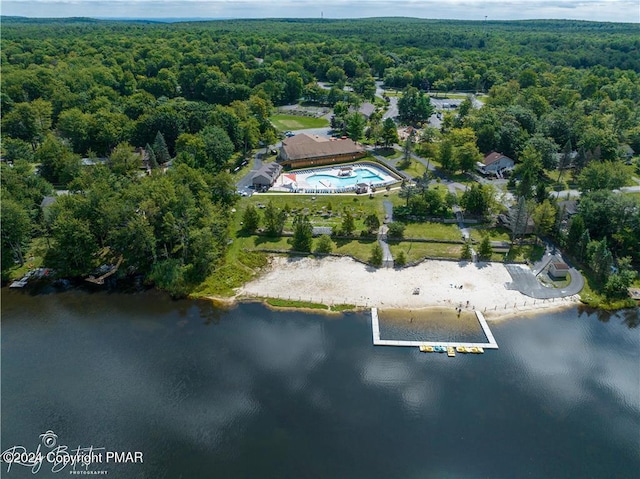 bird's eye view featuring a water view and a view of trees