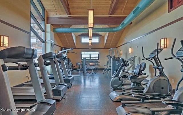 exercise room featuring wood ceiling and vaulted ceiling