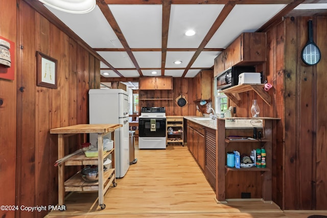 kitchen featuring open shelves, electric range, freestanding refrigerator, wood walls, and coffered ceiling