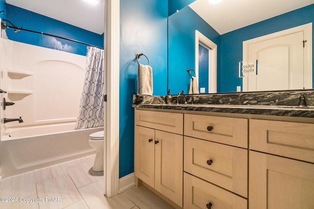 bathroom featuring a sink, shower / bathtub combination with curtain, toilet, and double vanity