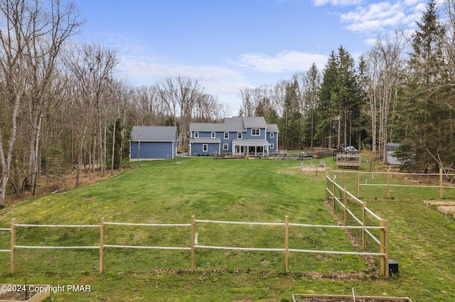 exterior space with fence and a front lawn