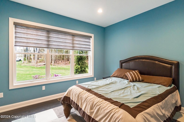 bedroom featuring baseboards