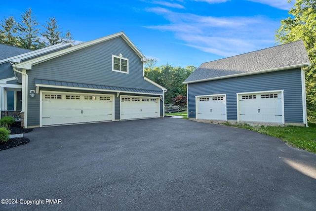 garage with aphalt driveway