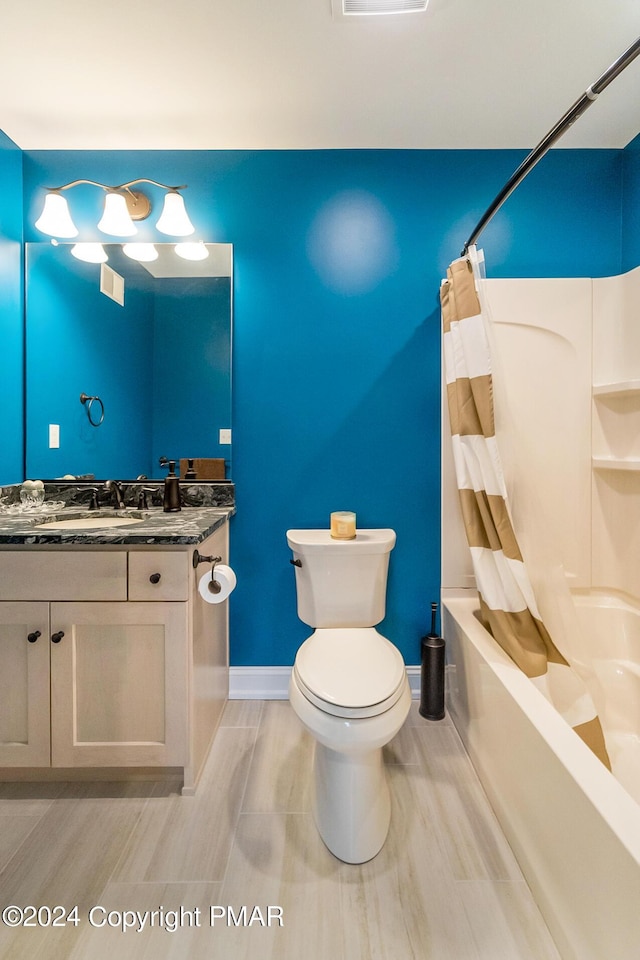 bathroom featuring shower / bath combo, baseboards, visible vents, toilet, and vanity