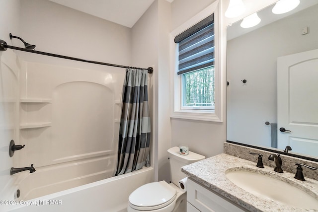 full bath featuring toilet, shower / bathtub combination with curtain, and vanity