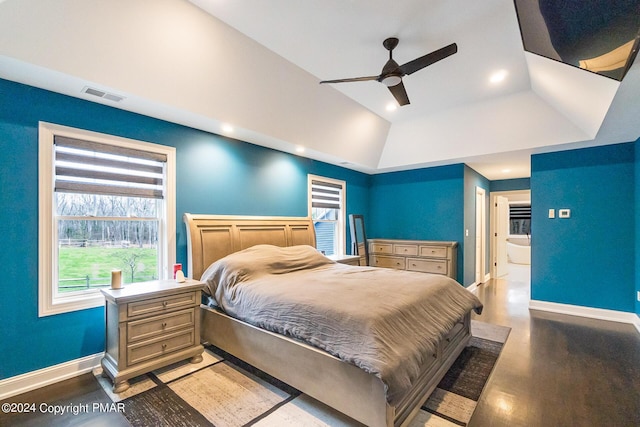 bedroom featuring light wood-style floors, lofted ceiling, visible vents, and baseboards