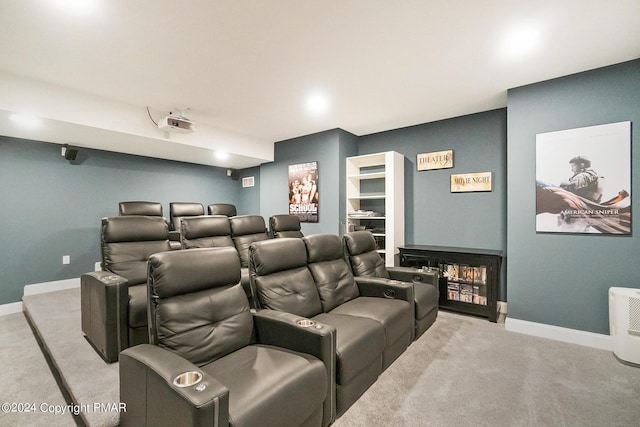 carpeted cinema room with baseboards