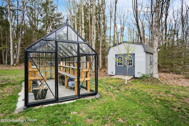 view of greenhouse featuring a lawn