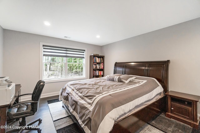 bedroom featuring recessed lighting, visible vents, dark wood finished floors, and baseboards