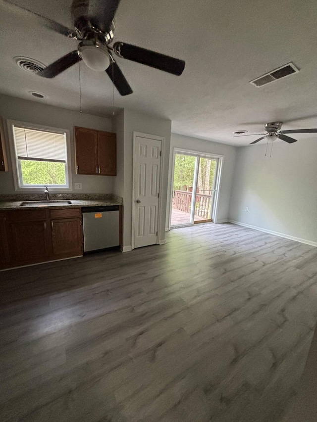 2754 Hedgerow Ln, Stroudsburg, PA 18360 - kitchen featuring stainless steel dishwasher, a sink, ceiling fan, and open floor plan