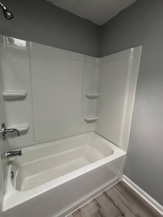 2754 Hedgerow Ln, Stroudsburg, PA 18360 - bathroom with wood finished floors, baseboards, and shower / bathtub combination