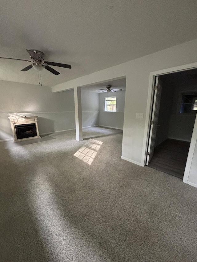 2754 Hedgerow Ln, Stroudsburg, PA 18360 - unfurnished living room with a fireplace, a ceiling fan, and carpet flooring