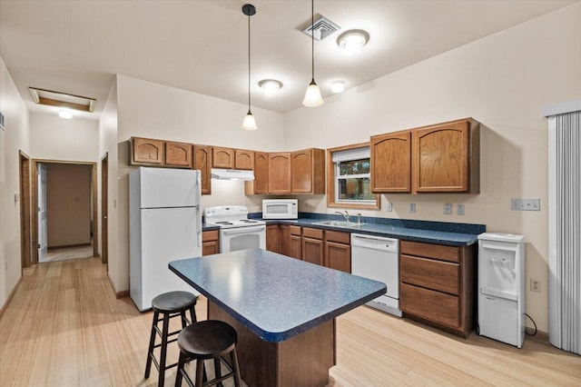 105 Waygood Way, Pocono Pines, PA 18350 - kitchen featuring white appliances, dark countertops, light wood-type flooring, and brown cabinets