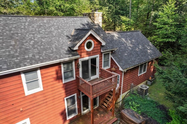 105 Waygood Way, Pocono Pines, PA 18350 - exterior space with a chimney, roof with shingles, a wooden deck, and stairway