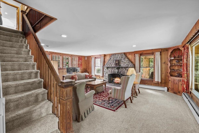 105 Waygood Way, Pocono Pines, PA 18350 - living area featuring a baseboard radiator, plenty of natural light, carpet floors, wooden walls, and recessed lighting