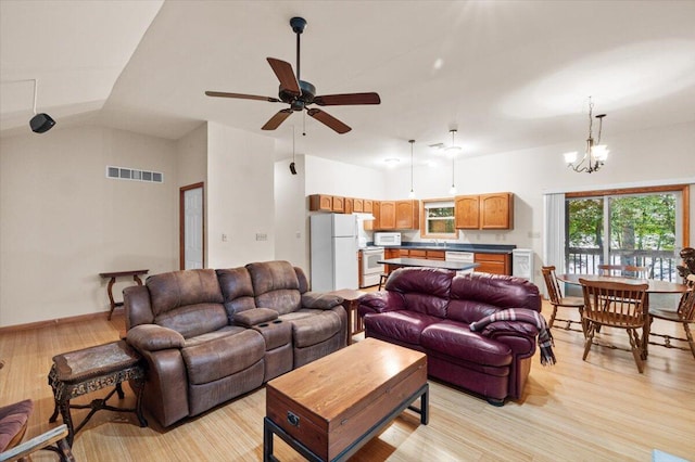 105 Waygood Way, Pocono Pines, PA 18350 - living area featuring light wood-style floors, ceiling fan, a chandelier, and high vaulted ceiling