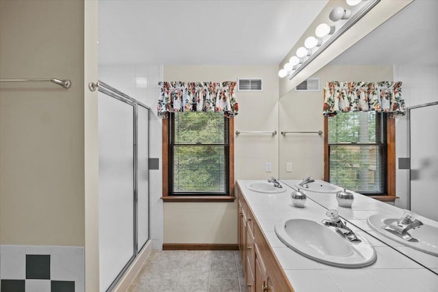 105 Waygood Way, Pocono Pines, PA 18350 - full bath with double vanity, a shower stall, and plenty of natural light