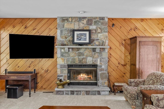 105 Waygood Way, Pocono Pines, PA 18350 - living area with carpet flooring, a fireplace, and wood walls