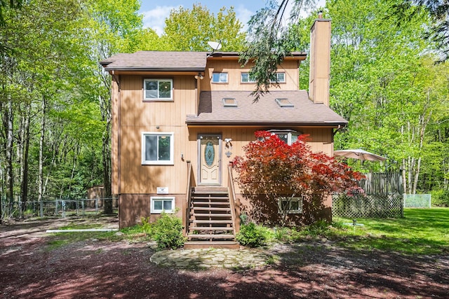 205 Victory Ln, Long Pond, PA 18334 - view of front of house featuring a chimney and a shingled roof
