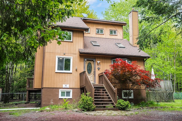 205 Victory Ln, Long Pond, PA 18334 - rustic home with roof with shingles, a chimney, and stairway