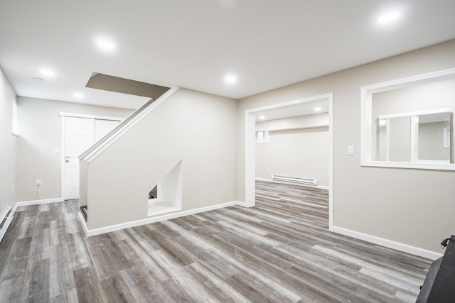 205 Victory Ln, Long Pond, PA 18334 - finished below grade area with a baseboard radiator, wood finished floors, baseboards, stairs, and recessed lighting