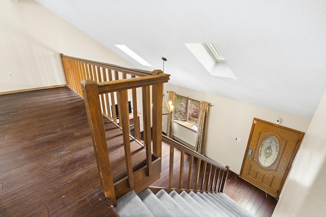 205 Victory Ln, Long Pond, PA 18334 - staircase featuring a skylight, lofted ceiling, and wood-type flooring