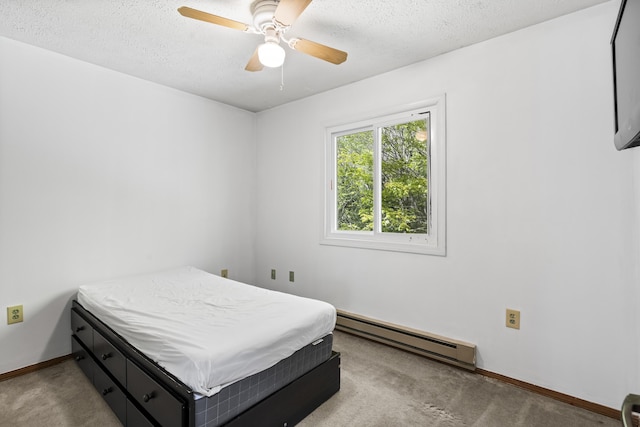 205 Victory Ln, Long Pond, PA 18334 - bedroom featuring baseboard heating, a textured ceiling, carpet, baseboards, and ceiling fan