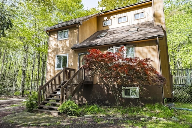 205 Victory Ln, Long Pond, PA 18334 - back of property with roof with shingles and stairway