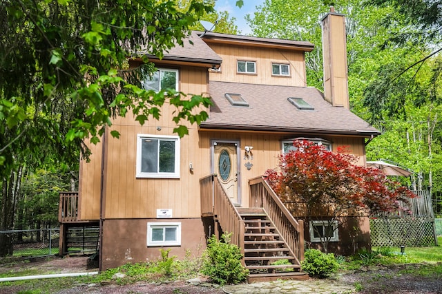 205 Victory Ln, Long Pond, PA 18334 - view of front of home with roof with shingles, a chimney, and stairs