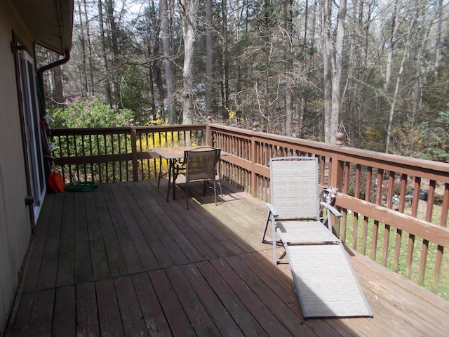 wooden deck with outdoor dining area