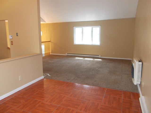 spare room featuring heating unit, carpet, baseboards, baseboard heating, and lofted ceiling