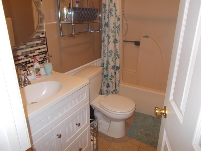 full bath with vanity, shower / bath combination with curtain, tasteful backsplash, toilet, and tile patterned flooring